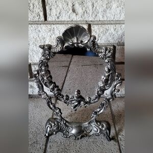 1940's Silver plated cherub vanity adjustable mirror in excellent condition!